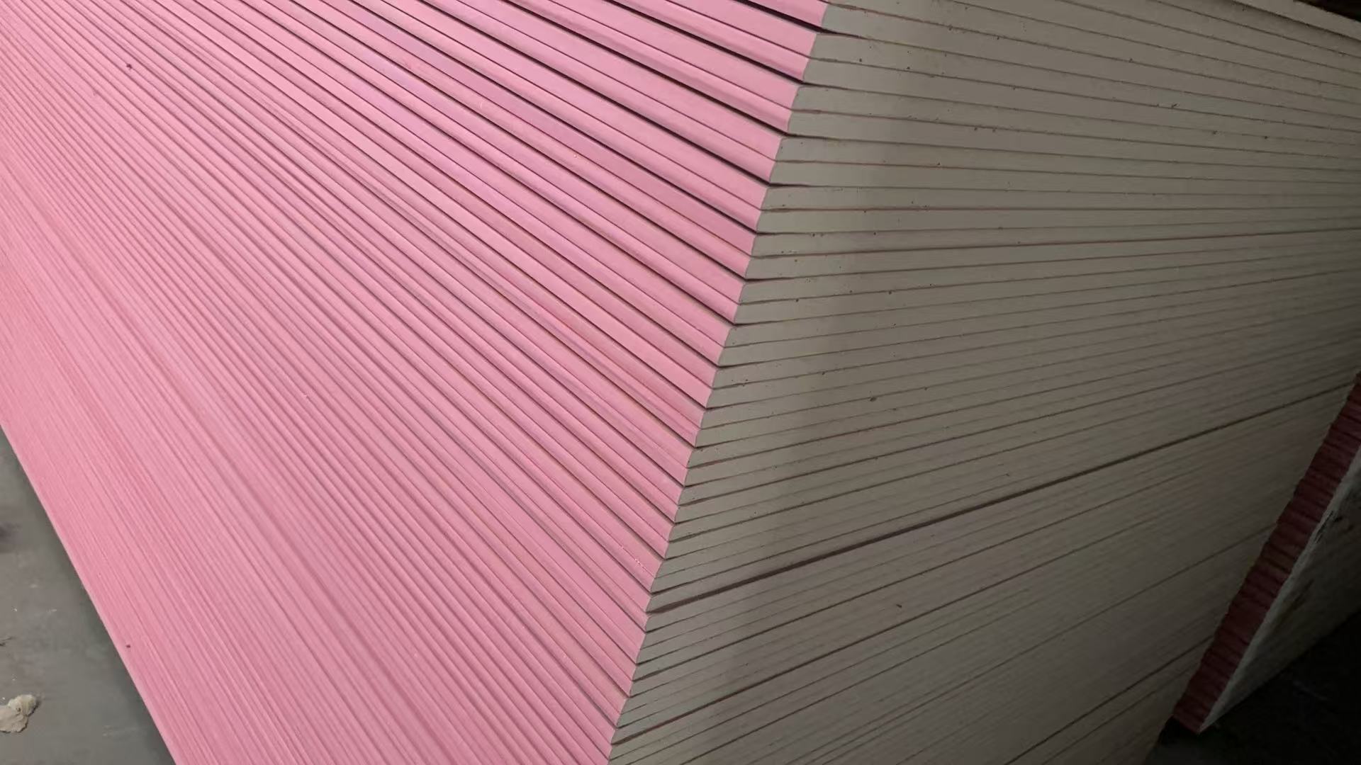 Pink fire-rated plasterboard sheets